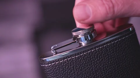 Flask for alcohol with metal glasses in a box Stock Footage 312604378