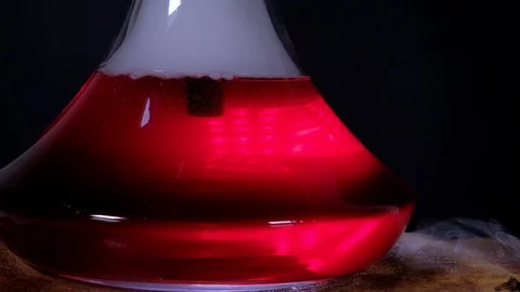 The flask hookah with a colored bubbling water in action Stock Footage 124970885