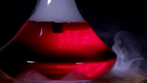 The flask hookah with a colored bubbling water in action Stock Footage 124970921