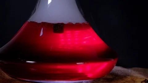 The flask hookah with a colored bubbling water in action Stock Footage 124970938