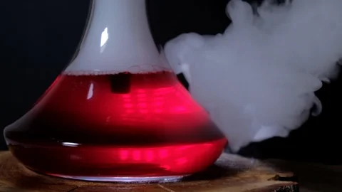 The flask hookah with red water a lot of smoke Stock Footage 124970955