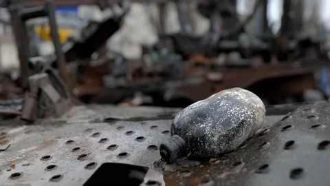 Flask lying on a burned Russian tank Видео 200132517