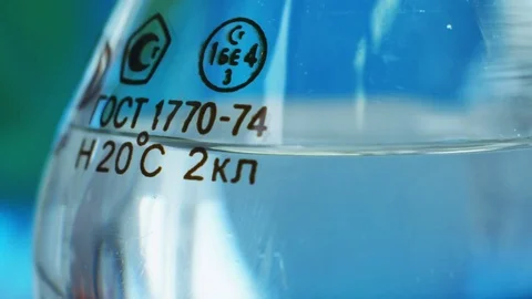 A flask with russian signs in a lab Stock Footage 72635317