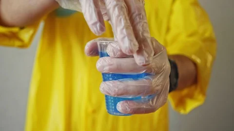 Flask in scientist hand. Laboratory technician at the work Stock Footage 103273324