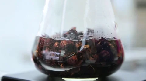 Flask with tea poured with water Stock Footage 63143774