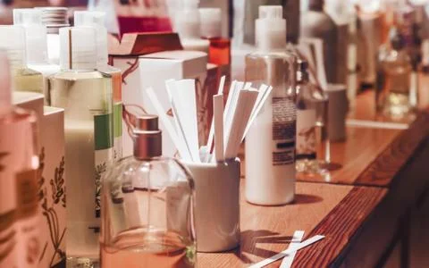 Flasks and examples of odor in the perfume shop. Stock Photos