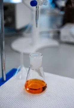 Flasks with brown liquid, science and medical research and development concept Fotos de archivo