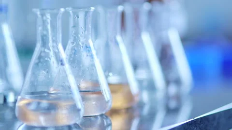 Flasks with chemical in laboratory Video stock 64983139