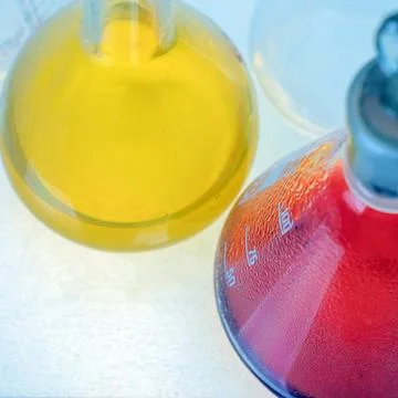 Flasks with colored liquid in the laboratory, close-up Stock Photos