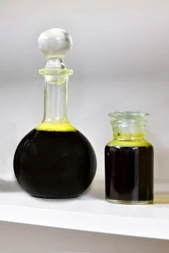 Flasks with raw vegetable oil. Stock Photos