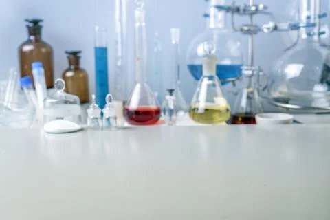 Flasks, test tubes and laboratory glassware with solutions of different color Stock Photos