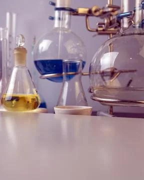 Flasks, test tubes and laboratory glassware with solutions of different color Stock Photos