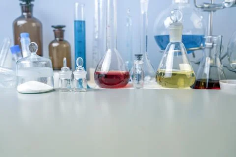 Flasks, test tubes and laboratory glassware with solutions of different color Stock Photos
