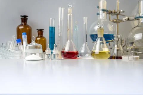 Flasks, test tubes and laboratory glassware with solutions of different colors Stock Photos