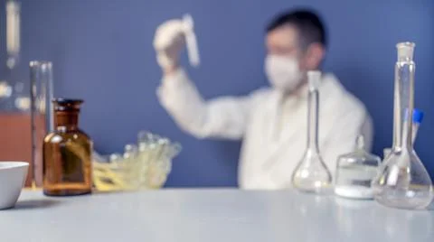 Flasks, test tubes and laboratory glassware with solutions of different color Stock Photos