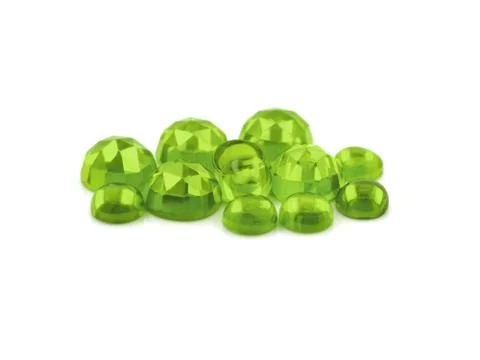 Flat back peridot cabochons on a white background Stock Photos