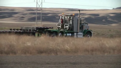 Flat Bed Truck Drives Down Road Video stock 43039673