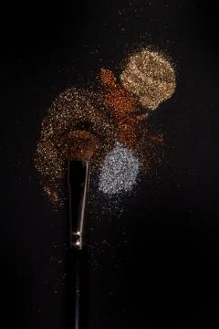 Flat blush brush with blush on it, loose powder and glitter blush, isolated. Stock Photos