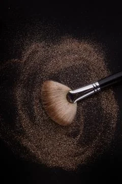 Flat blush brush with blush on it, loose powder and glitter blush, isolated. Фото