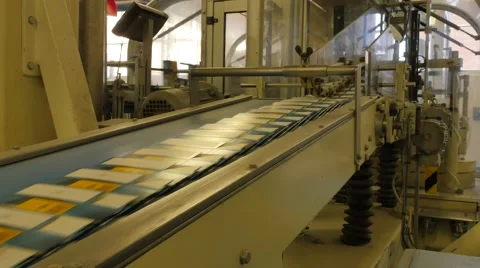 Flat boxes travelling along the assembly line in a rice factory – 4K Stock Footage 67990892