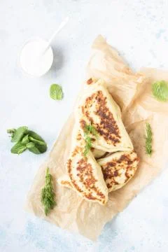 Flat bread with fresh herbs and yogurt dressing. Stock Photos
