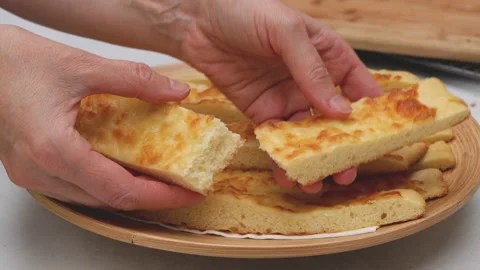 Flat bread with mozzarella cheese topping step by step baking process, close up  Stock Footage 145785968