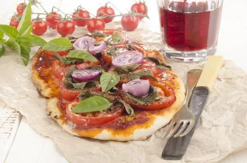Flat bread pizza with tomato Stock Photos