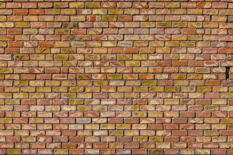 Flat brick wall texture and background with diagonal bricks storage imprints Photos