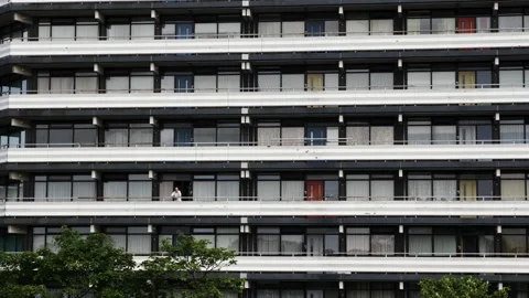 Flat building balconies with man Vídeo Stock 263983412