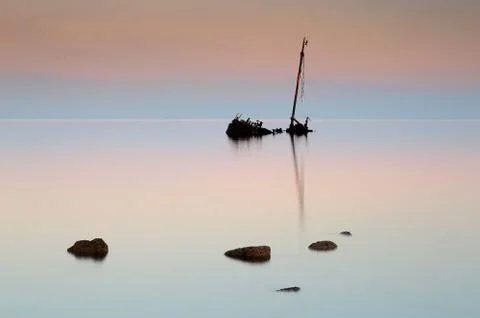 Flat calm shipwreck Stock Photos
