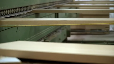 Flat chipboard elements transporting on edge processing machine. Stock Footage 118958973