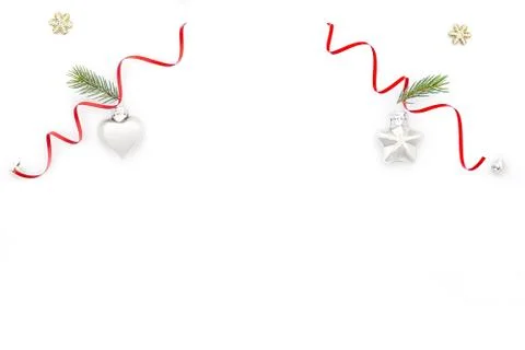 Flat Christmas composition on white background with a red ribbon, a toy in th Stock Photos