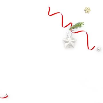 Flat christmas composition on white background with red ribbon, star toy and  Stock Photos