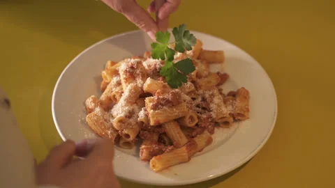 Flat with circular movement of the chef's hand placing the parsley on a plate 스톡 동영상 130265638