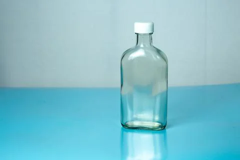 A flat clear transparent bottle Stock Photos