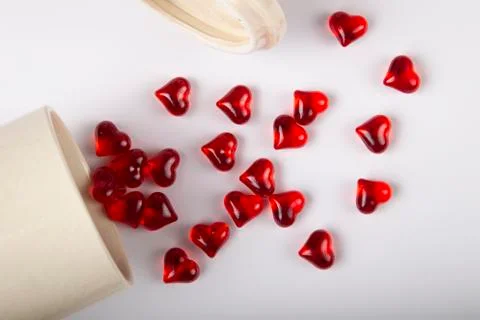 Flat closed red small crystals hearts on white background Stock Photos