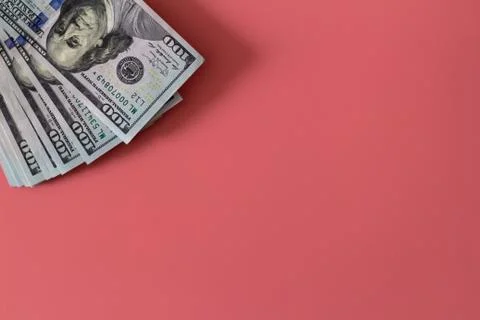 Flat closeup of dollars on pink background. Investment profit income. Success Stock Photos