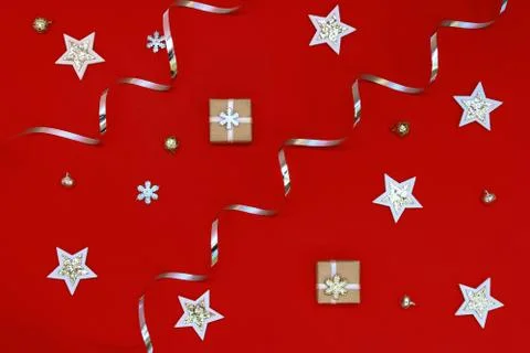 Flat composition of Christmas decorations in silver and holiday boxes on a re Stock Photos