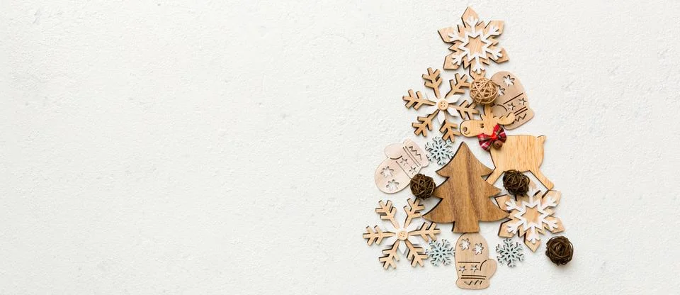 Flat composition with a Christmas tree made of different festive items, snowf Stock Photos