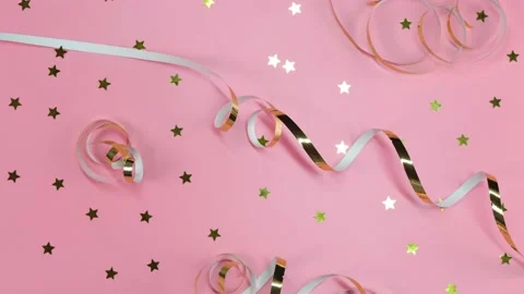 Flat composition of gold ribbons or serpentine and gold confetti Stock Footage 166462723