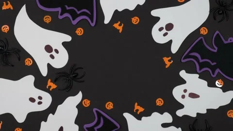 Flat composition of Halloween decorations rotates on black background. top view. Stock Footage 213395677