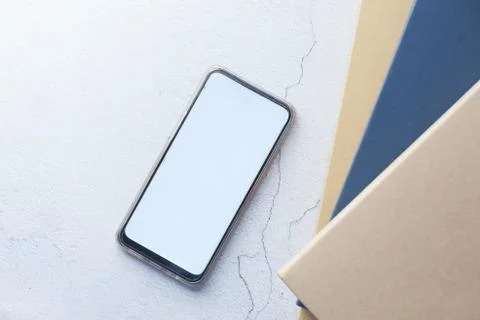 Flat composition of smart phone and stack of books 스톡 사진