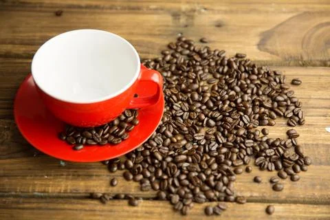 Flat design featuring red ceramic coffee cup and matching saucer sitting on Stock Illustration