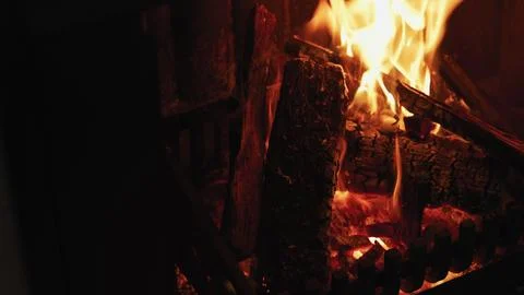 Flat design illustration is showing burning logs on metal grate with glowing Stock Photos