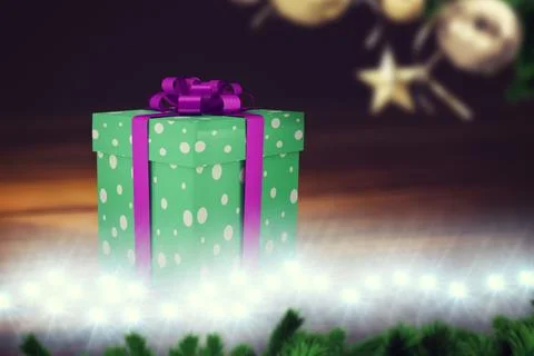 Flat design polka-dotted purple-ribboned gift box is sitting on table, fairy Stock Illustration