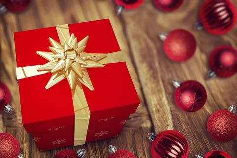 Flat design red gift box with gold ribbon bow is sitting on wood table with 스톡 일러스트