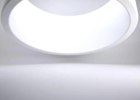 Flat design is showcasing large circular ceiling light fixture glowing in Stock Photos