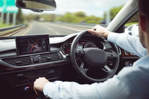 Flat design is showing back seat view of right-hand drive car, driver steering Stock Photos
