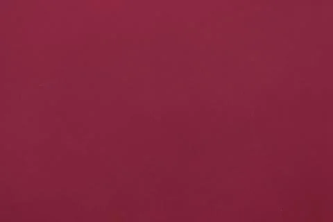 Flat design is showing solid maroon surface filling entire frame in minimal Stock Photos