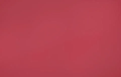 Flat design solid red background is spreading across frame, creating bold color Stock Photos